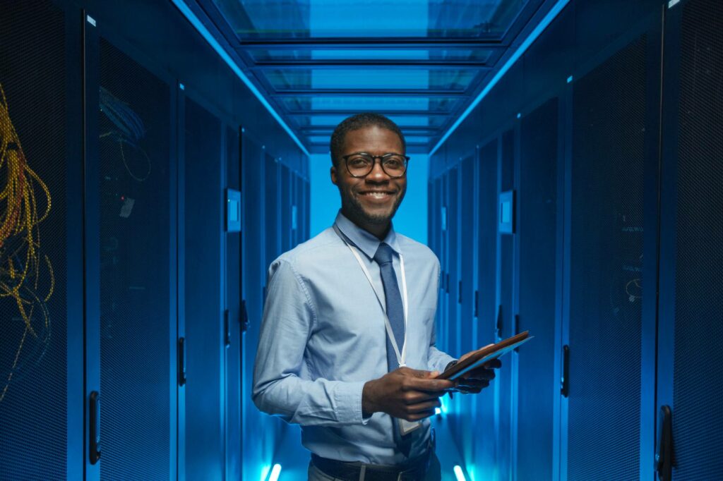Cloud solutions consultant smiling in data center